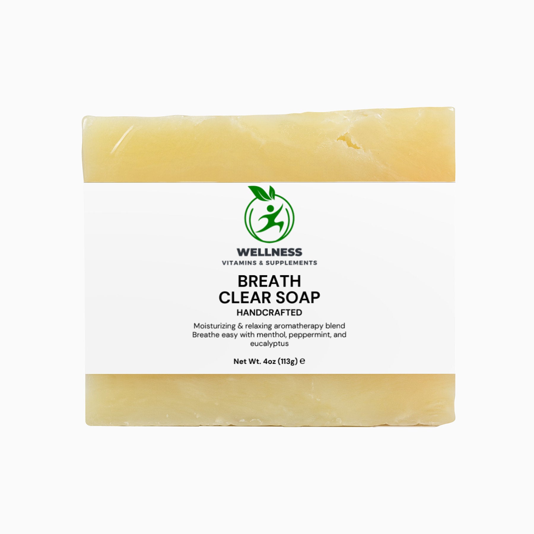 A fresh Breathe Clear Soap bar with eucalyptus leaves and mint beside it, symbolizing a cooling, refreshing, and decongesting cleanse.

