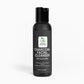 A sleek bottle of Charcoal Facial Cleanser with a rich, foamy texture, designed for deep pore cleansing and oil control.